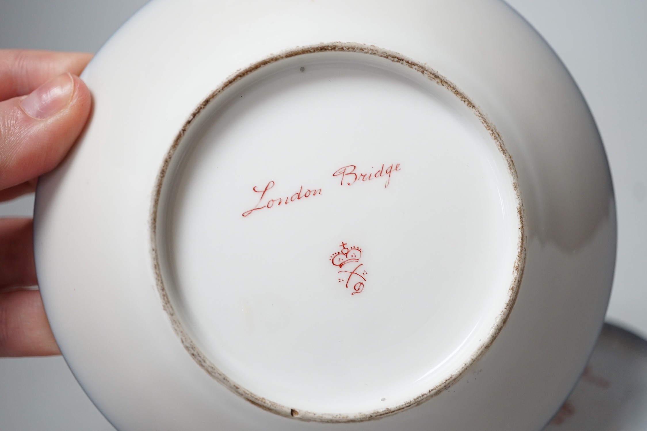 A Continental Derby style cup and saucer, 8cm tall overall